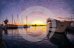 Yacht port and beautiful sunset over Varna, Bulgaria. Sailboat harbor, many beautiful moored sail yachts in the sea