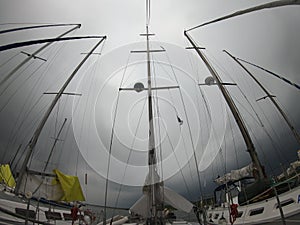 Yacht port at sunrise. Timelapse of yacht marina. Red sky over yacht harbour at morning. Clouds sky. Row of sail masts