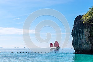 Yacht with red sails in the Andaman Sea