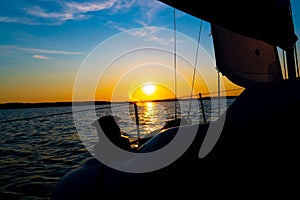 Yacht Sailing against sunset. Sailboat. Yachting. Sailing photo