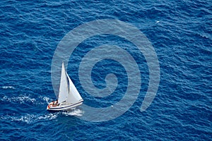 Yacht sailing in blue sea