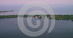 Yacht is sailing in lake Ontario, Canada. Beautiful view of sailing yacht in lake near airport in daytime. Enjoy nice