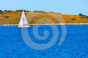 Yacht sailing near the island