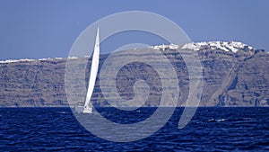 Yacht sailing off Santorini island