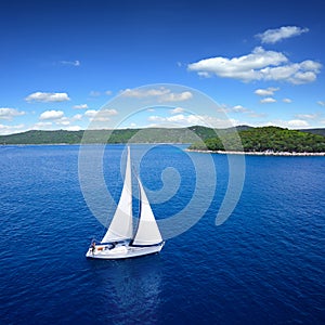 Yacht sailing on open sea at windy day