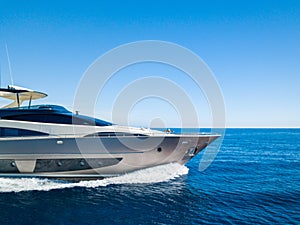 Yacht sailing on the sea with a clear blue sky in the background
