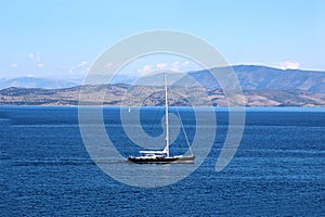 Yacht sailing on the sea. Ionian sea. Sea and mountain view