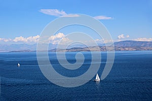 Yacht sailing on the sea. Ionian sea. Sea and mountain view