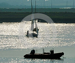 Yacht sailing at sunset