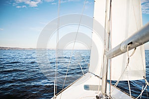 Yacht sailing towards the sunset