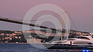 Yacht sailing under the bridge
