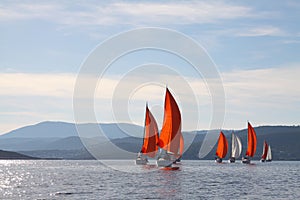 Yacht at sea against the backdrop of the mountains