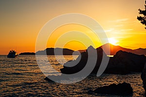 Yacht in the sea at sunset. Silhouette of a yacht on the backgro