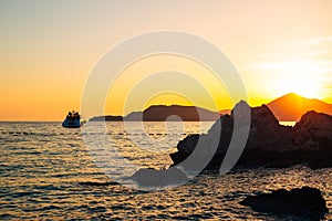 Yacht in the sea at sunset. Silhouette of a yacht on the backgro