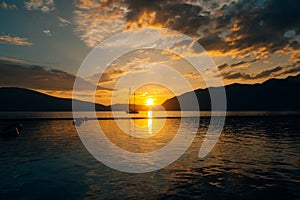 Yacht in the sea at sunset. Silhouette of a yacht on the backgro