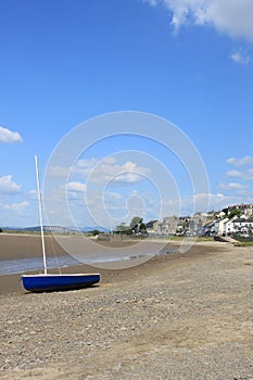 Yacht on seashore at Arnside, Cumbria, England.