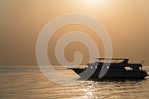 The yacht stands at the pier at dawn