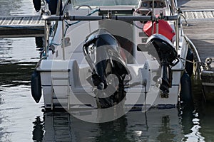 Yacht stern on with two outboards photo