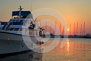 Yacht at sunrise at Mandraki harbor