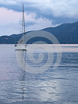 Yacht at sunset on the island of Kefalonia in the Ionian Sea in Greece