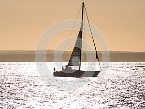 A yacht at sunset in the Solent