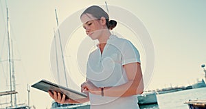 Yacht, tablet and sailing with woman on pier for cruise, management and travel. Boat crew, network and digital with