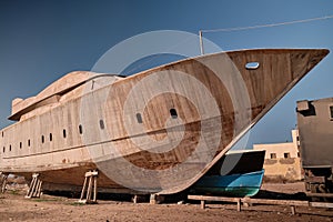 Yacht at wharf under construction