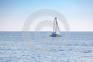 Yacht with white sails