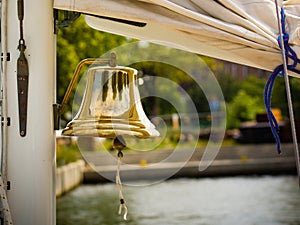 Yachting. Bell on sailing ship. Detail of a yacht boat