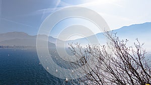 Yachting. Landscape panorama with yacht sailer ship sailing by lake or sea waves in evening sunset sun sunbeams. Fishing