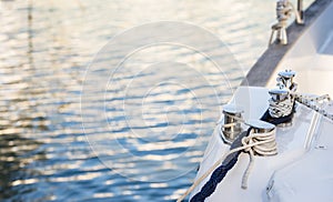 Yachting, luxury sailboat at marina with close-up of nautical ropes at winch