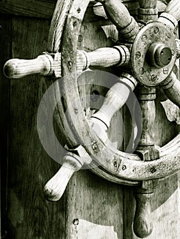 Yachting. Ship wooden steering wheel. Sailboat detail.