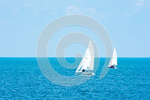 Yachting. Tourism. Luxury Lifestyle. Ship yachts with white sails in the open sea.