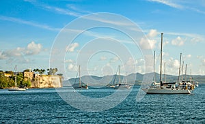 Yachts anchored in Fort De France harbor with fortress in the background, Fort-De-France, Martinique,  French overseas department photo