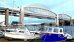 Pleasure craft on beach beside Tamar Bridge