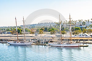 Yachts docked on ocean waterfront harbor in California