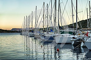 Yachts in the marina at sunset in the evening