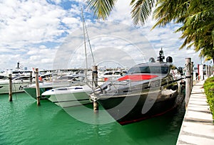 Yachts in miami marina bay at south beach with cloudy sky