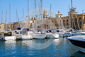 The yachts moored in the harbor in front of Malta Maritime Museum. Malta.