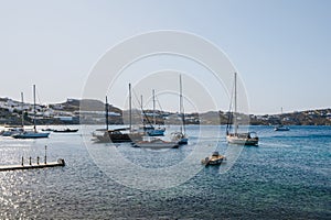 Yachts moored in Mediterranean sea by Agios Ioannis, Mykonos, Greece