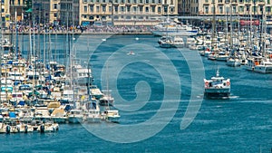 Yachts and motorboats leaving Marseille Vieux Port, busy water traffic timelapse