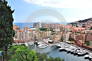 yachts port in front of buildings beside the sea