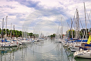 Yachts and sailboats moored in the canal in Rimini photo