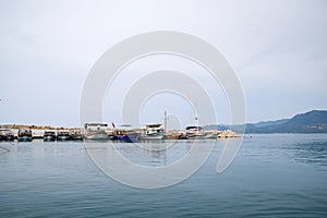 Yachts on the sea coast. Pleasure boats at pier