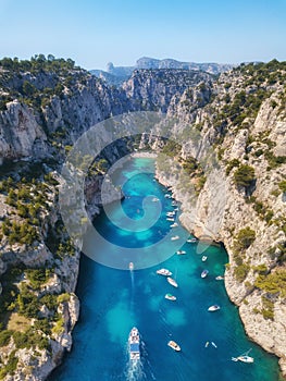 Yachts at the sea in France. Aerial view of luxury floating boat on transparent turquoise water at sunny day.