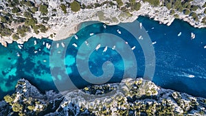 Yachts at the sea in France. Aerial view of luxury floating boat on transparent turquoise water at sunny day.