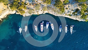 Yachts at the sea in France. Aerial view of luxury floating boat on transparent turquoise water at sunny day.