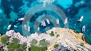 Yachts at the sea in France. Aerial view of luxury floating boat on transparent turquoise water at sunny day.