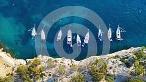 Yachts at the sea in France. Aerial view of luxury floating boat on transparent turquoise water at sunny day.