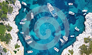 Yachts at the sea in France. Aerial view of luxury floating boat on transparent turquoise water at sunny day.